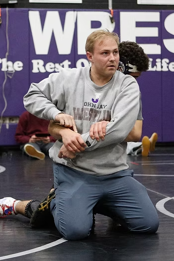 A familiar face and name takes over John Jay wrestling program